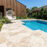 Crazy Paving Around a Swimming Pool With Classic Travertine